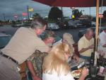 Tom Weides, Glenn Green, & Jim Roesch go through a photo album