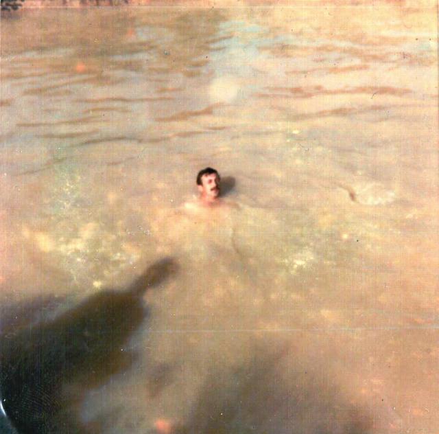 Green swims in bomb crater